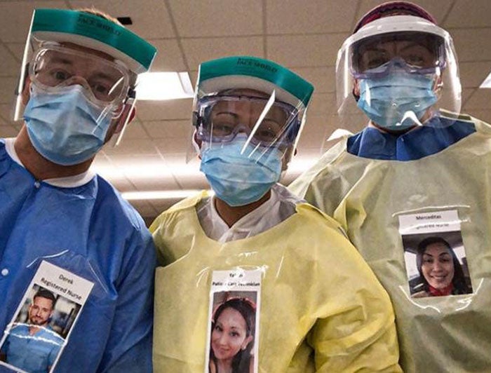 Health Care Workers in PPE Wear Photos of Themselves Smiling