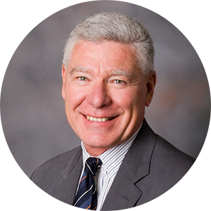 Jim Austin headshot. Former senior executive at Baxter Healthcare.